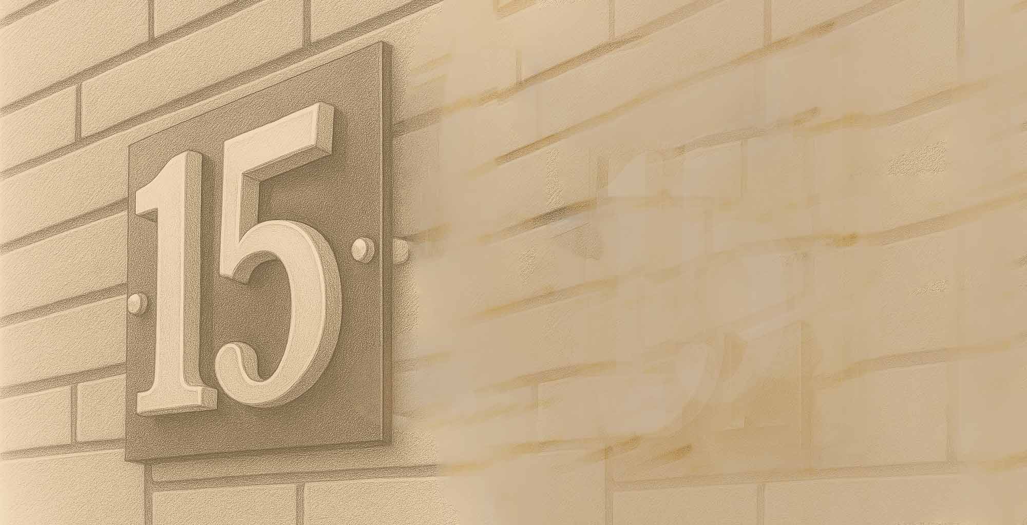 House number '15' on a beige brick wall